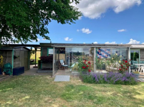 4 pers Holiday Home Hilla with winter garden in front of the dike directly on the Lauwersmeer